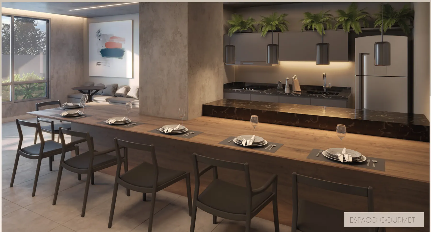 Espaço gourmet com bancada, mesa longa e cozinha equipada