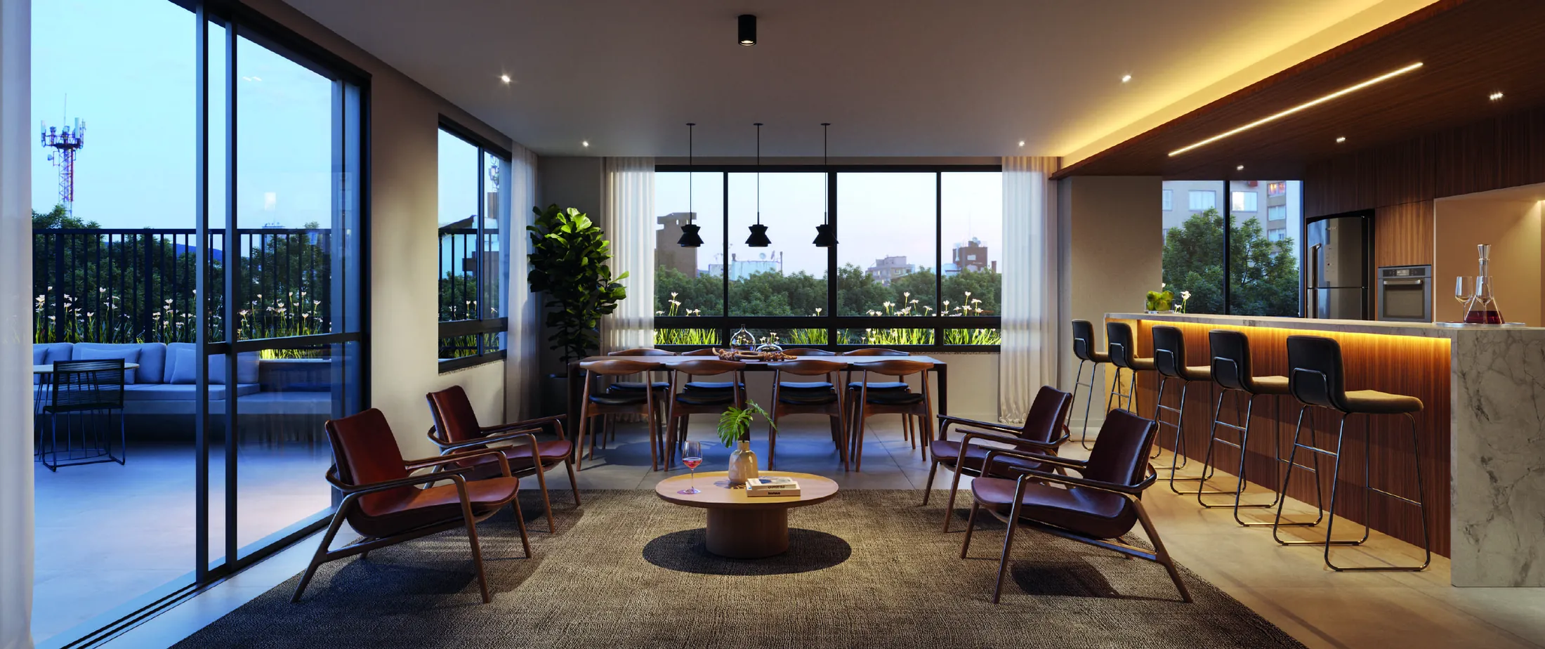 Espaço gourmet com bancada, poltronas e janelas amplas